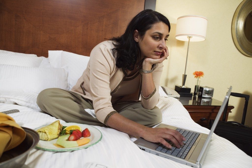 Woman in the hotel bed