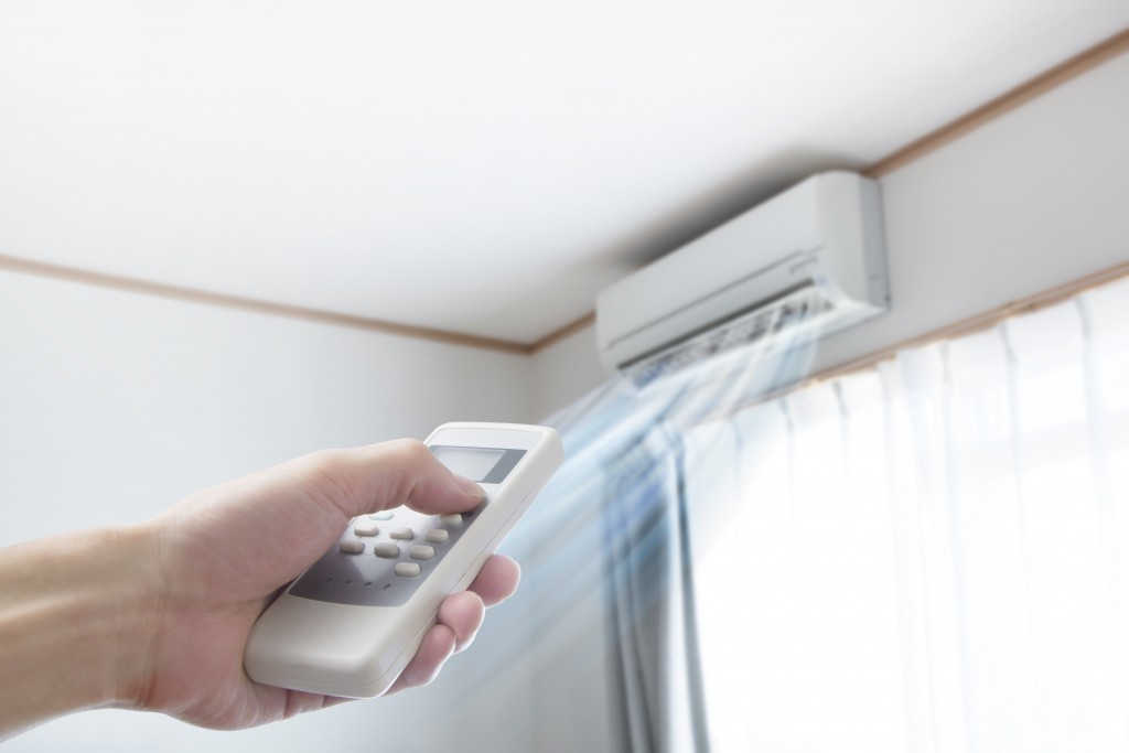 Man turning on the AC