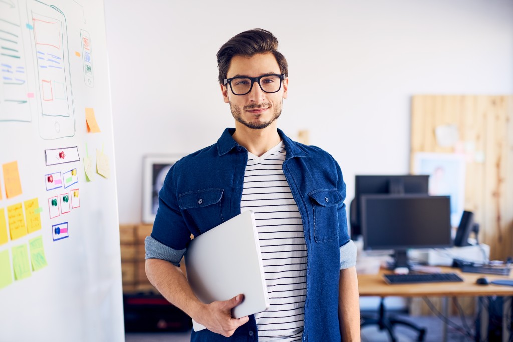 Interior designer with his laptop